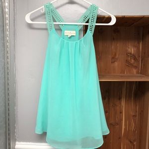 DONATING Flowy tank with detailed straps